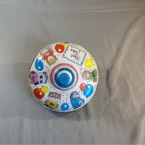 Vintage Ohio Arts Metal Spinning top toy Shirt Tales